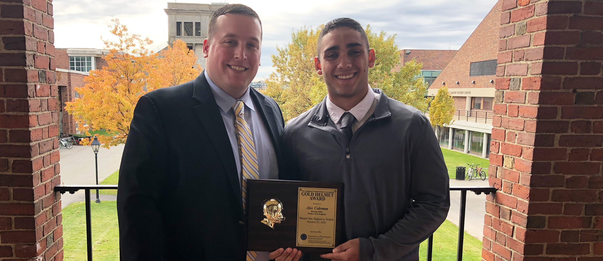 Western New England junior quarterback Alec Coleman (right) received the NEFW DII/DIII Gold Helmet Award on Wednesday at Harvard's Dillon Fieldhouse.
