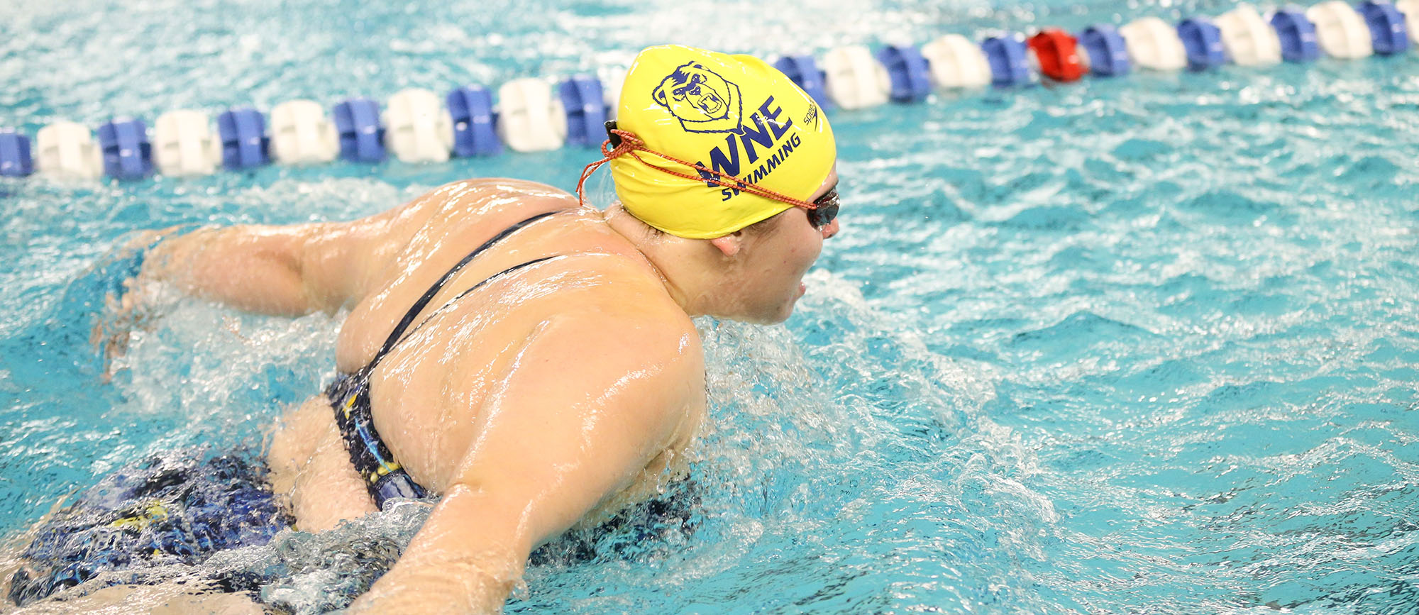 Senior Anna Boucher swam season-best times in three races on Wednesday as the Golden Bears defeated Elms, 148-105.